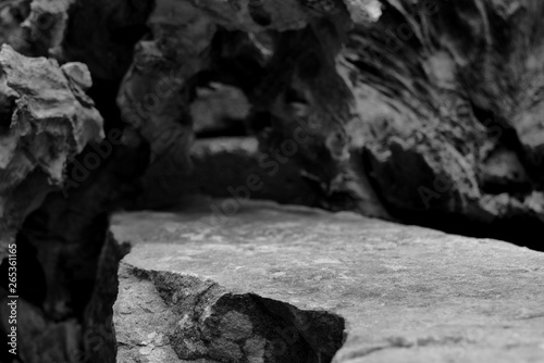 Fotografie The Top of a Rock Shelf, Showing Lower Close Focus to the Mineral Stepped Edge, Leading to a Blurred Tree Root Cave Entrance