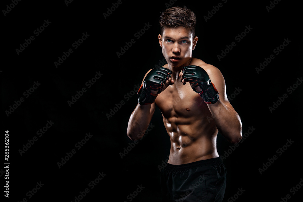 Sportsman man boxer fighting on black background with shadow. Copy Space. Boxing sport concept.