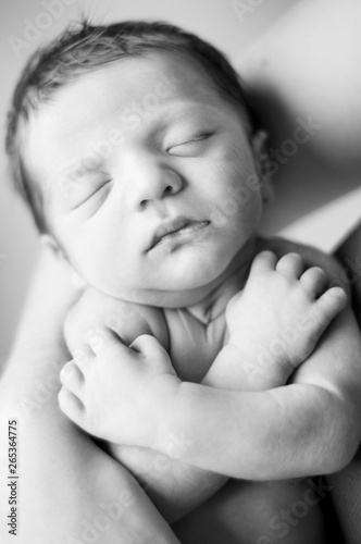 Newborn Baby Held in Mother's Arms