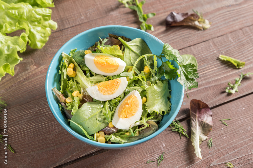 Mixed vegetable salad with egg on rustic background Mixed vegetable salad with egg on rustic background