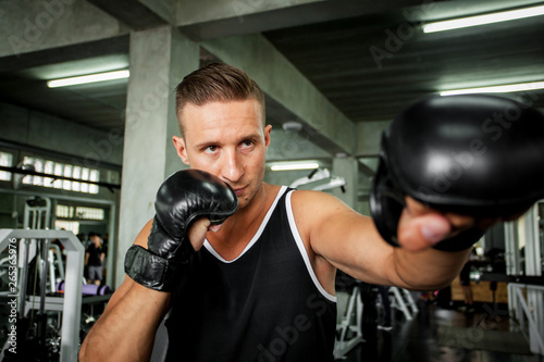 Male exercising in boxing gloves