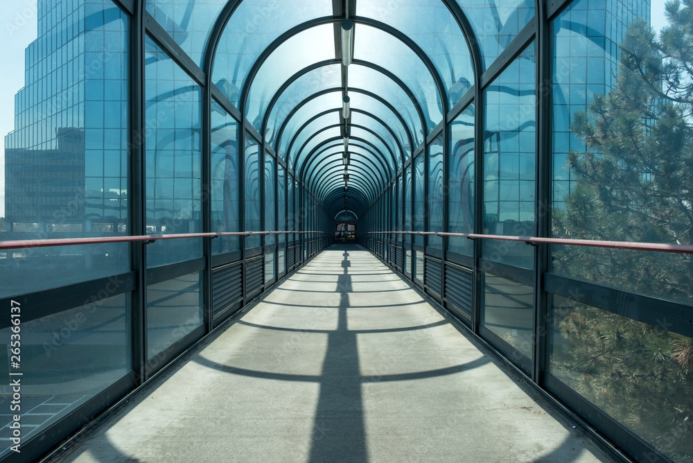 Abstract industrial outdoor covered walkway glass tunnel. Pedestrian
