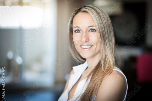 Portrait Of A Pretty Blond Woman Smiling At The Camera