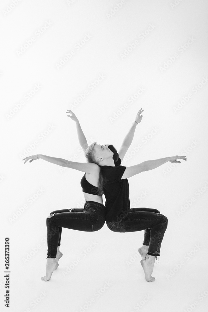 Flexible young modern dance couple posing in studio. Stock Photo by  ©vova130555@gmail.com 196740056