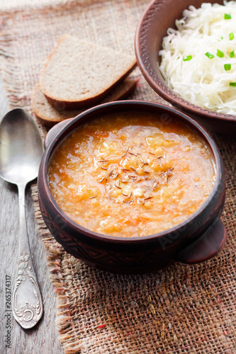 Kapustnyak - traditional Ukrainian winter soup with sauerkraut, millet and meat