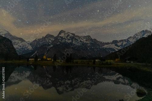 Reflection of the mountain with stars in the lake