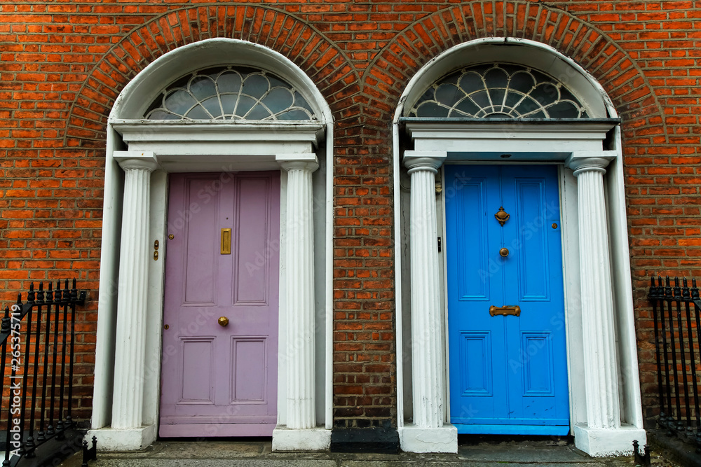 Georgian architecture and painted house doors with red brick facade in Dublin city centre; Dublin, Leinster, Ireland Georgian architecture and painted house doors with red brick facade in Dublin city centre; Dublin, Leinster, Ireland