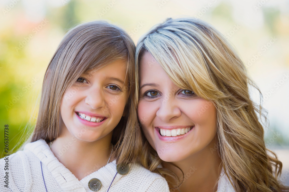 Portrait of a mother and daughter in a park in autumn; Edmonton, Alberta, Canada Portrait of a mother and daughter in a park in autumn; Edmonton, Alberta, Canada