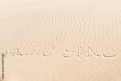 inscription on the sand: baltic sand