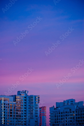 Wallpaper Mural Buildings in city at sunset. City illuminated by the last rays of the setting sun. Torontodigital.ca