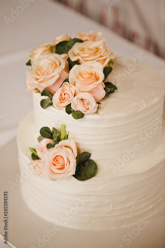 Festive wedding cake with flowers  pink-orange flowers  bunk  beautiful