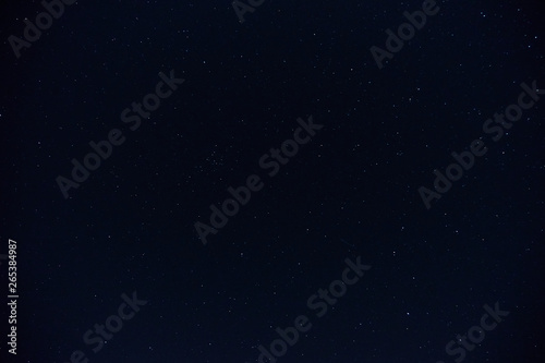 The night sky with stars and clouds. Natural background.