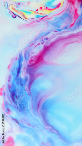 Fluid art. Multicolored abstract background on the liquid. Color pattern in the style of pop art. Multicolored fluid stains. Widescreen