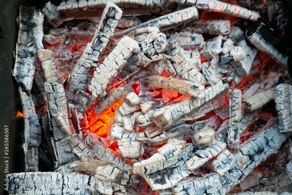Hot burning coals in the grill. BBQ cooking picnic Hot burning coals in the grill. BBQ cooking picnic