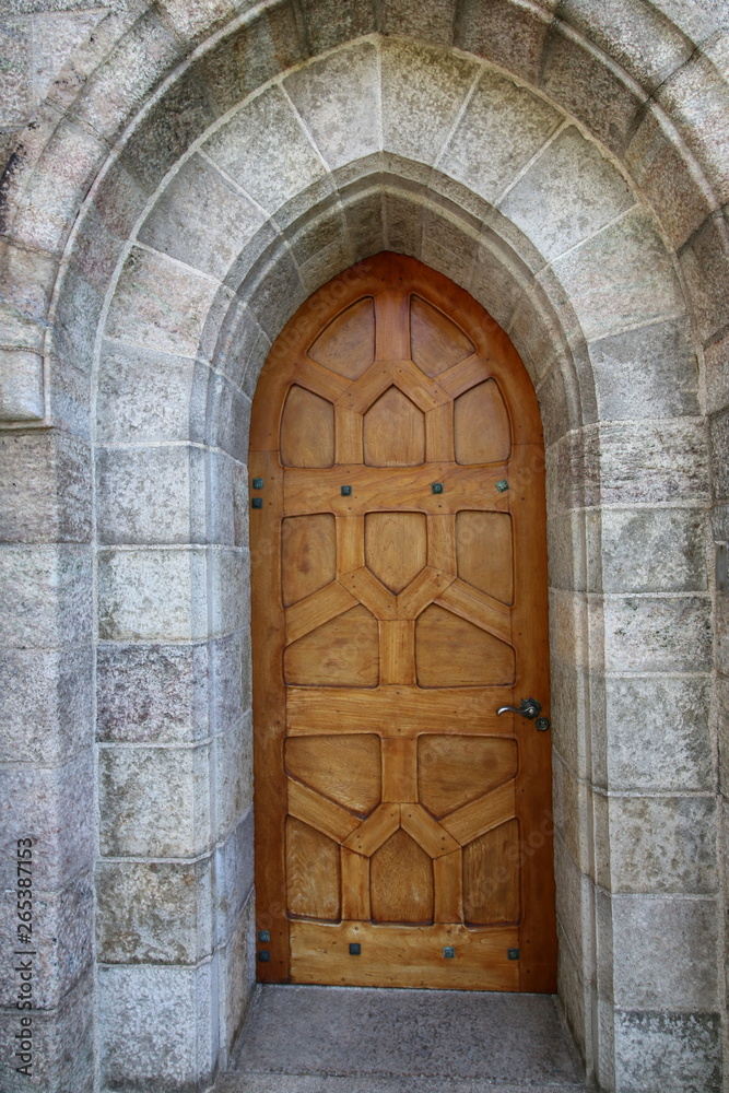 The soft color of the wood door.
