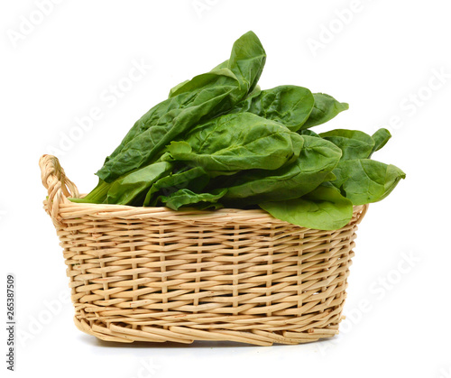 Fresh leaves of spinach in basket