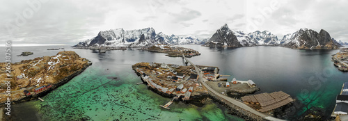 Sakrisøya fishing villages with mountains in the background, Lofoten Norway.
