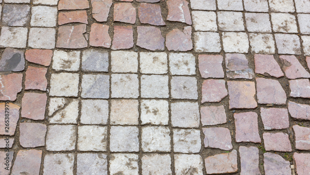 Paving stones in the old European city. Background from paving stones. Stone road in the old town. Stone pattern Paving stones in the old European city. Background from paving stones. Stone road in the old town. Stone pattern