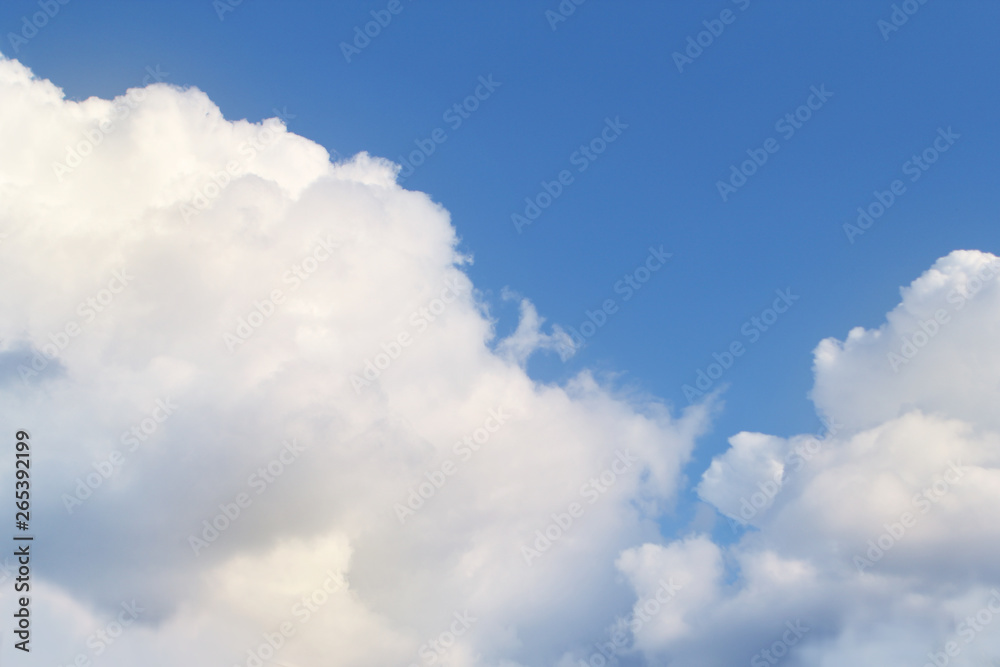 white, fluffy, cumulus clouds on a blue sky background white, fluffy, cumulus clouds on a blue sky background