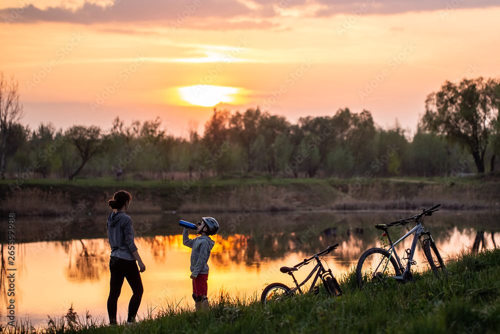 Family bike ride at sunrise