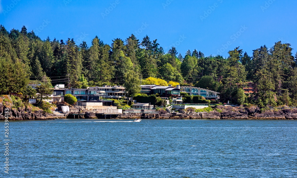 The village is on the shore of the bay on the wooded slope of the suburb of West Vancouver.  Horseshoe Bay   West Vancouver British Columbia, Canada
