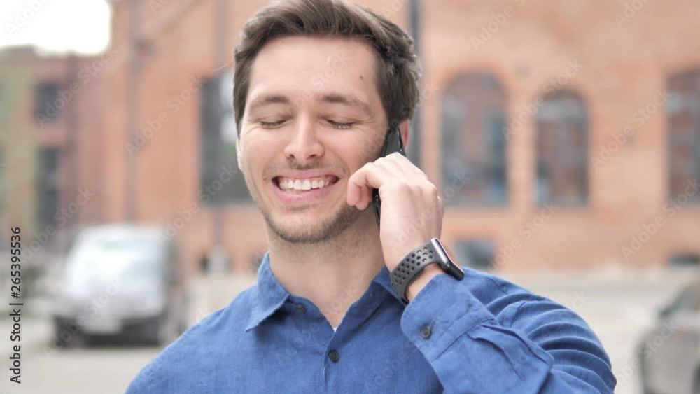 Outdoor Portrait of Young Man Talking on Phone Outdoor Portrait of Young Man Talking on Phone