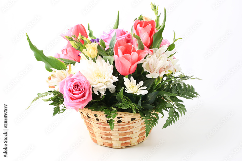 basket of flowers isolated on white background.