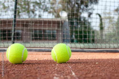 tennis ball on a tennis court © izzetugutmen