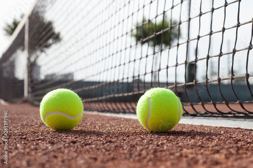 tennis ball on a tennis court © izzetugutmen