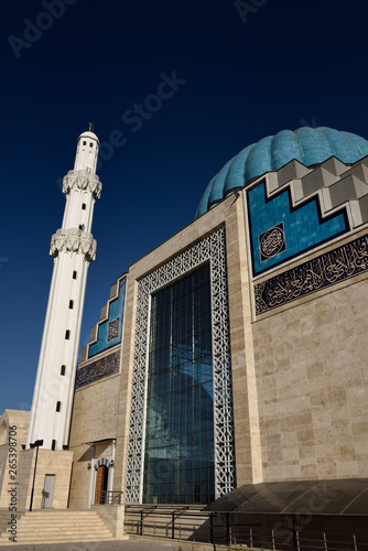 White minaret and ribbed dome of modern Hoca Ahmet Yesevi Mosque in Turkistan Kazakhstan