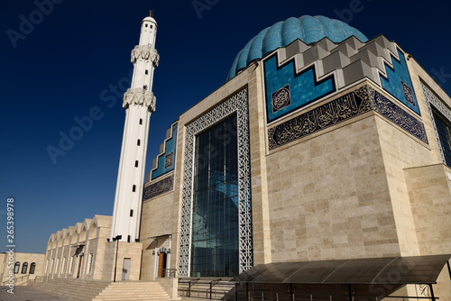White minaret of modern Hoca Ahmet Yesevi Mosque in Turkistan Kazakhstan photo