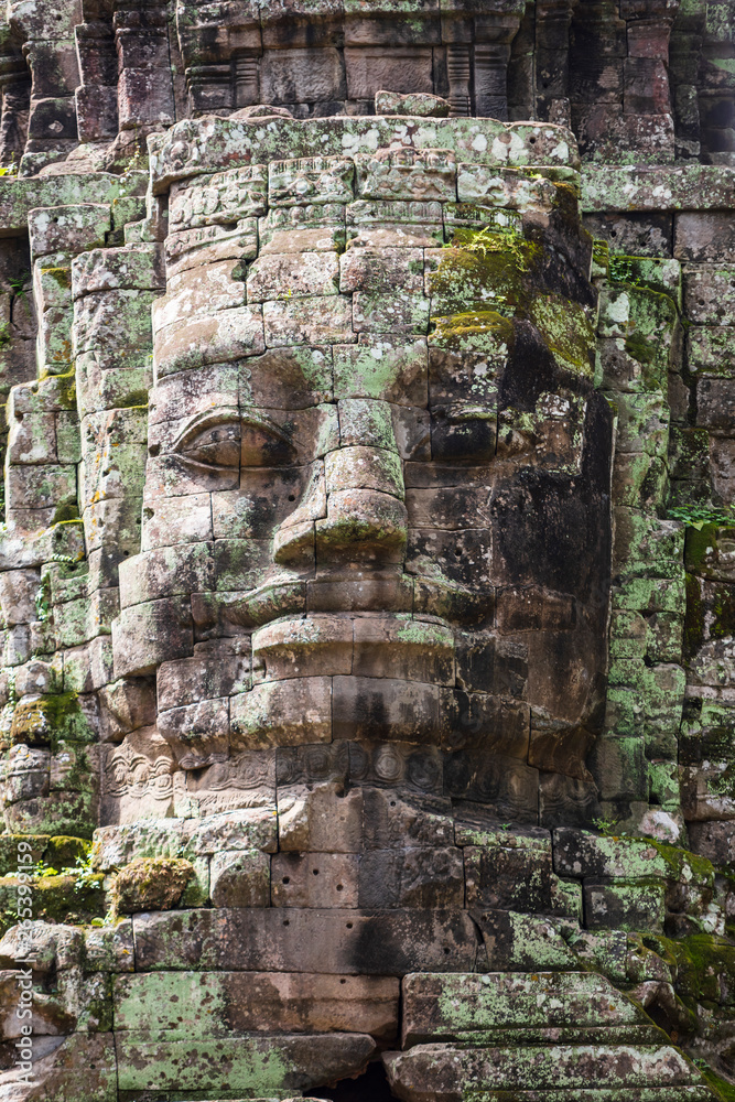 Face details from the beautiful north gate at Angkor Thom temple complex, Siem Reap, Cambodia