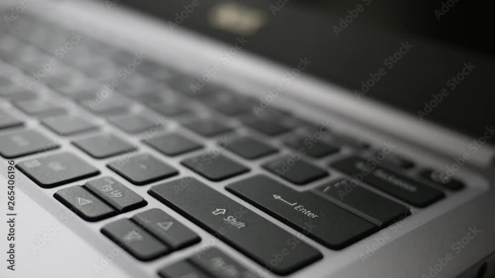 Finger dramatically presses the enter button on laptop Finger dramatically presses the enter button on laptop