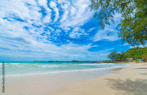 beach and tropical sea  on blue sky background. © stockchalathan
