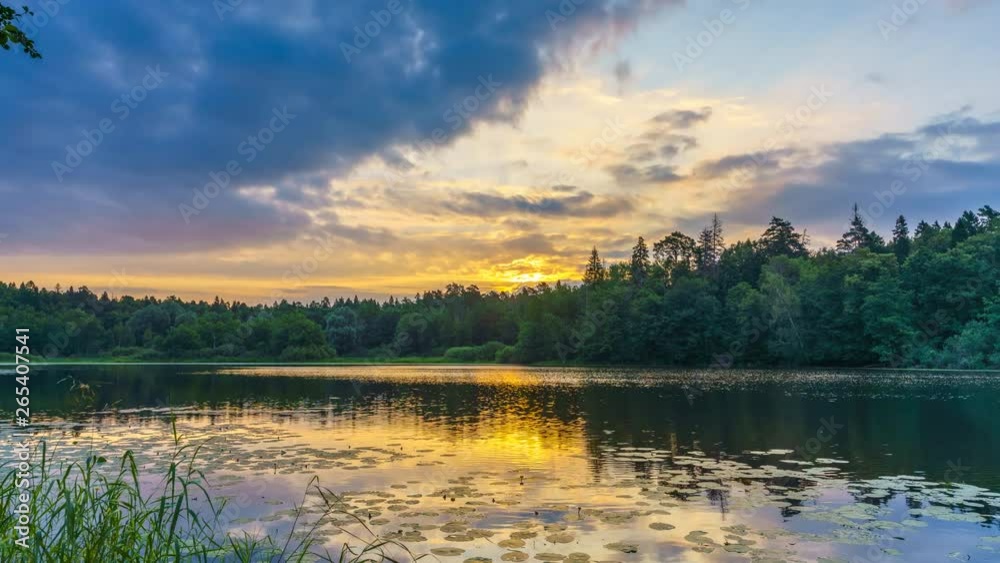 Timelapse of beautiful cloudy sunrise on a forest lake Timelapse of beautiful cloudy sunrise on a forest lake