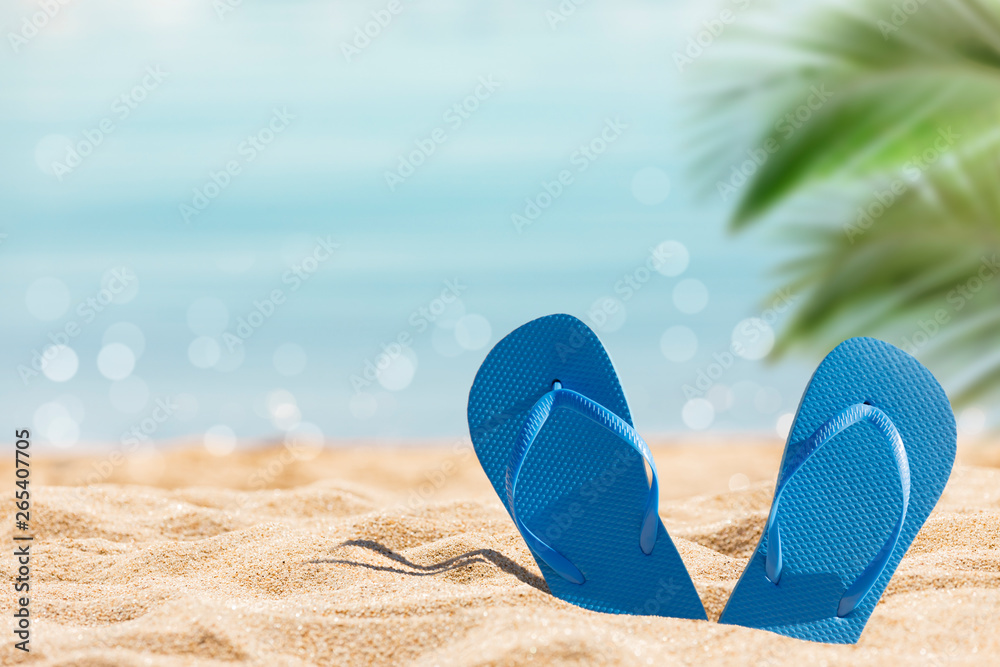 flip flops on the sunny tropical beach with palm trees and turquoise water, Caribbean island vacation, hot summer day - obrazy, fototapety, plakaty 