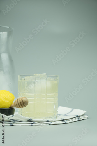 Cocktail glass of lemonade and ice cubes