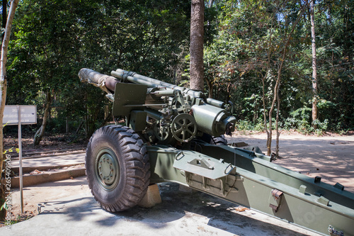 Front view of a 155mm Vietnam War artillery on display at Cu Chi Tunnels in Saigon, Vietnam. photo