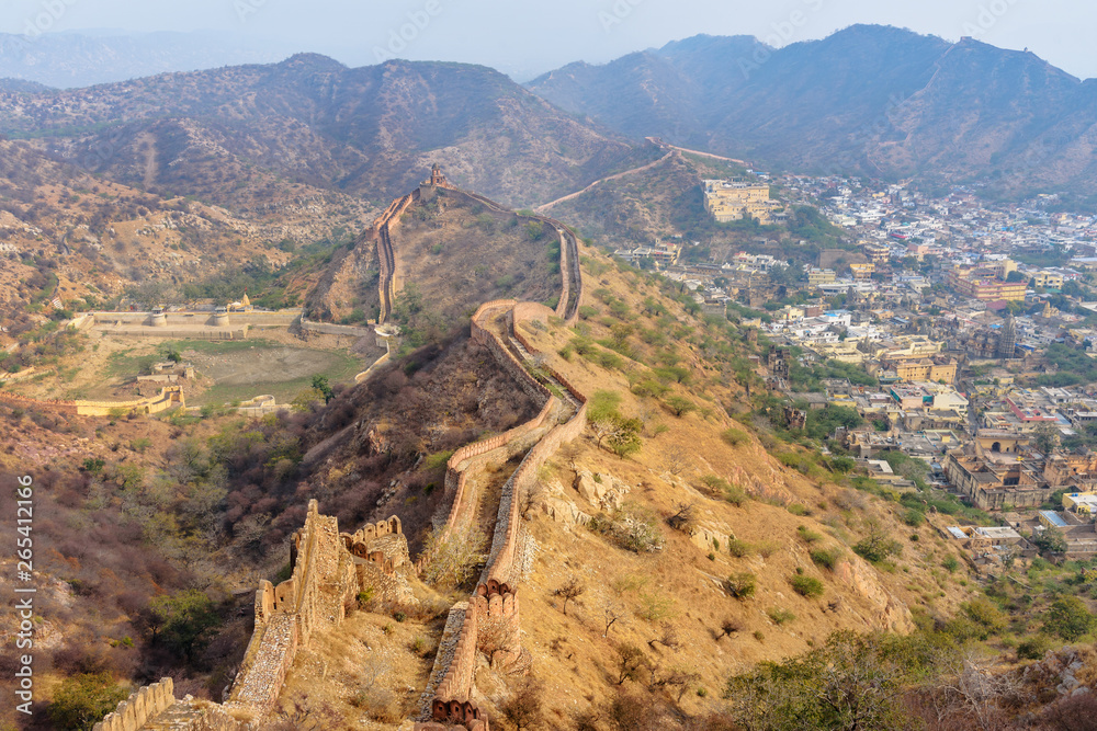 Ancient long wall with towers around Amber Fort, view from Jaigarh Fort. Rajasthan. India