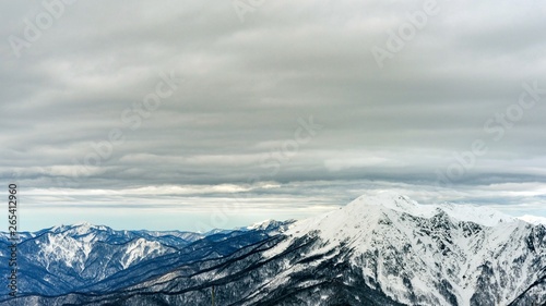 Awesome view of the Caucasus mountains covered by snow in the ski resort of Krasnaya Polyana, Russia.