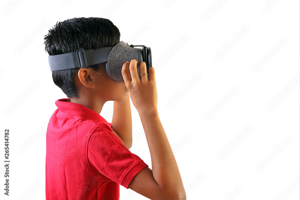 Indian young boy wearing Virtual Reality Glasses, Playing video games Indian young boy wearing Virtual Reality Glasses, Playing video games