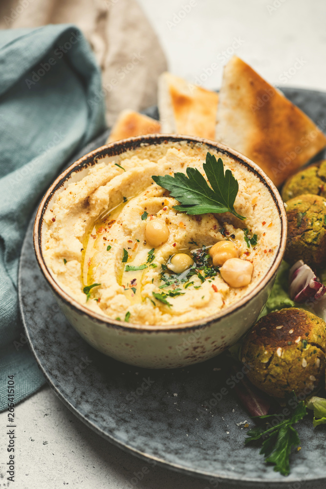 Chickpea Hummus and falafel served with pita bread. Closeup view. Arabic, vegetarian healthy food, snack or appetizer