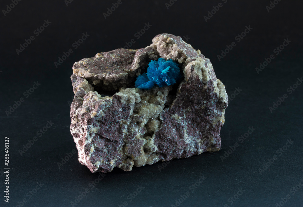 Cavansite mineral from Poona, India. a deep blue hydrous calcium vanadium phyllosilicate mineral, occurring as a secondary mineral in basaltic and andesitic rocks along with a variety of zeolite. Cavansite mineral from Poona, India. a deep blue hydrous calcium vanadium phyllosilicate mineral, occurring as a secondary mineral in basaltic and andesitic rocks along with a variety of zeolite.