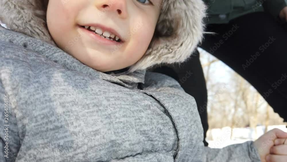 A cute little child saying Hi, taking selfie. Young blogger, beginner. Video chat, vlog. Closeup face of kid. Winter, outdoors, sunny day A cute little child saying Hi, taking selfie. Young blogger, beginner. Video chat, vlog. Closeup face of kid. Winter, outdoors, sunny day