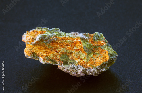 Studtite radioactive mineral from Shinkolobwe. A secondary uranium mineral containing peroxide formed by the alpha-radiolysis of water during formation. Yellow needle-like crystals in acicular spray.