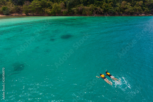 Couple swim in sea