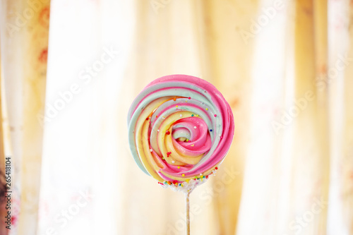 sweet meringue candy dessert with wood stick hommade photo