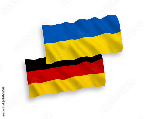 National vector fabric wave flags of Germany and Ukraine isolated on white background. 1 to 2 proportion.