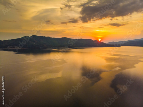 Silhouette lake sunset with colourful sky cloud