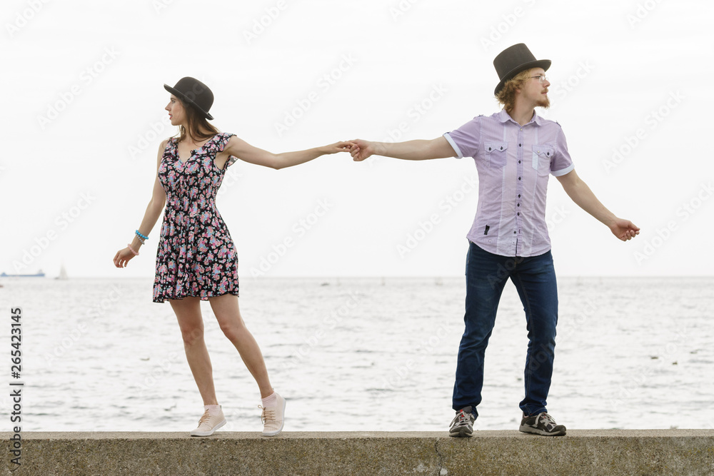 Fototapeta premium Retro couple looking opposite directions
